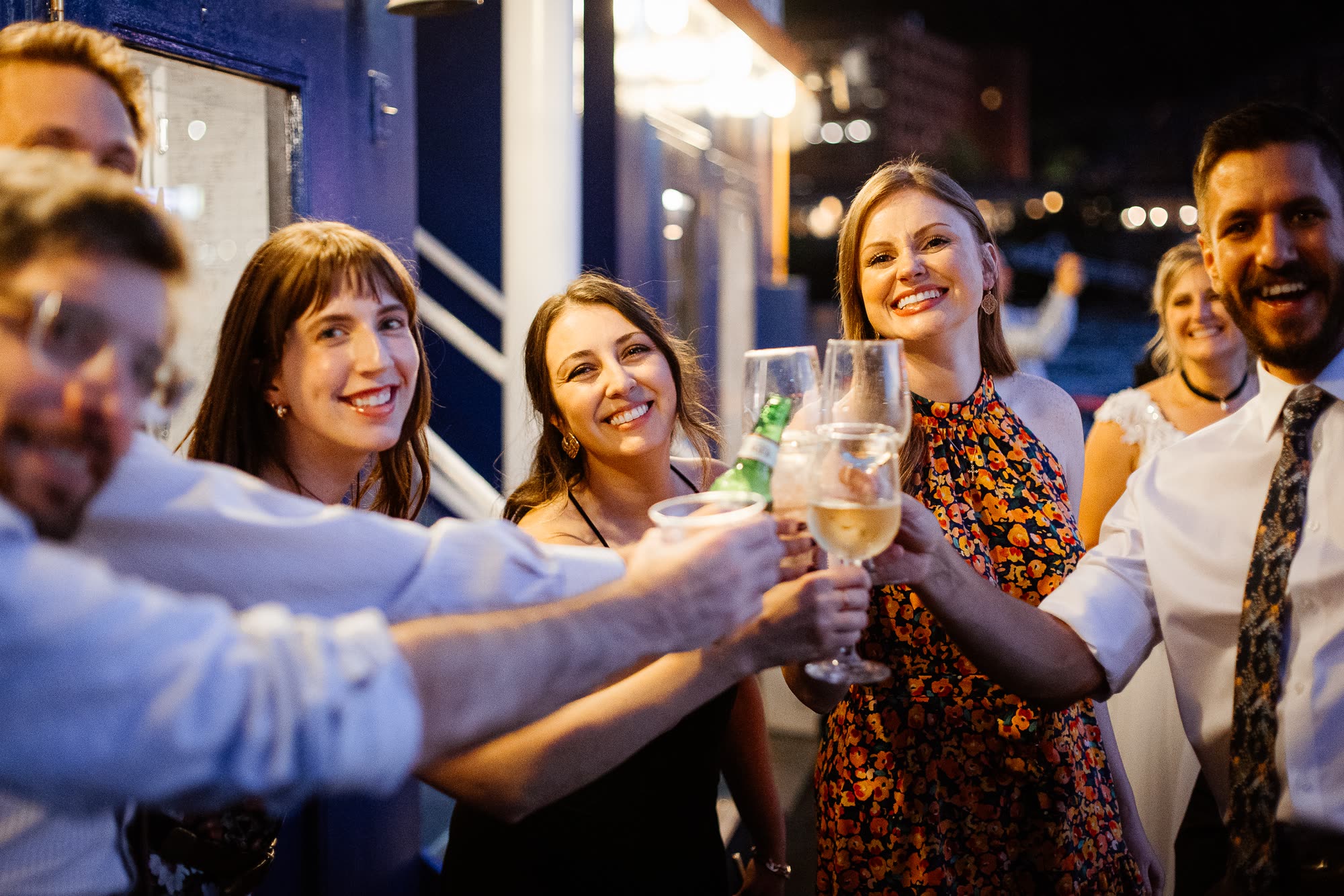 Guests raising a toast on deck at a private event aboard a Gateway Clipper riverboat