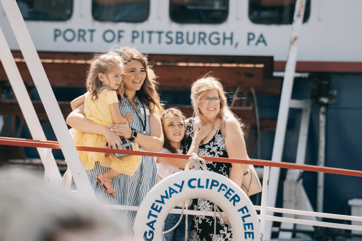 A group of people about to board a boat