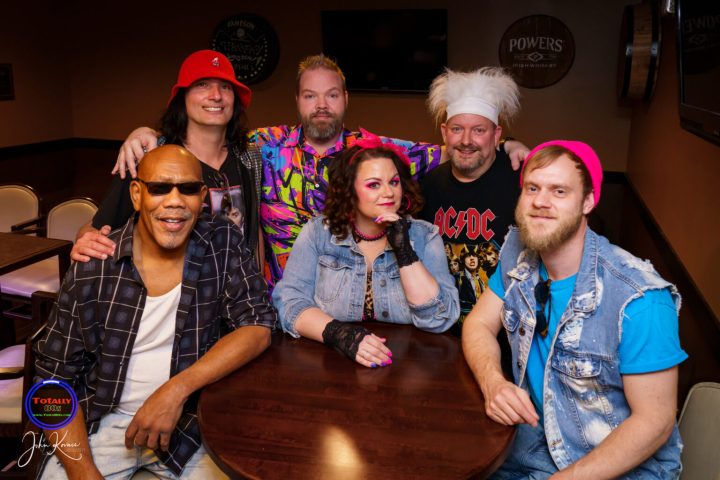 a group of people posing for the camera