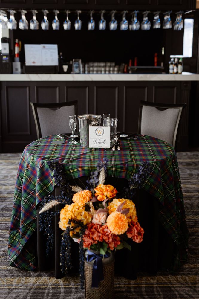 a vase filled with flowers sitting on a table